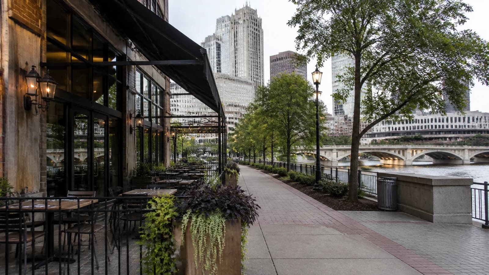 Editorial view of Scioto Mile riverfront and restaurant patio beside Bicentennial Park in Downtown Columbus, Ohio.