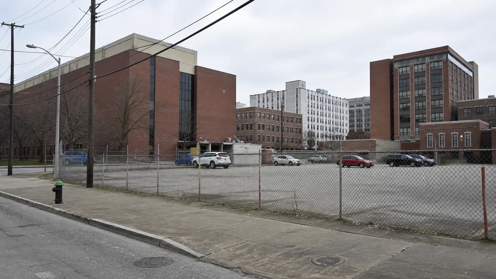 Illustrated Discovery District parking lots with translucent proposed buildings and garage.