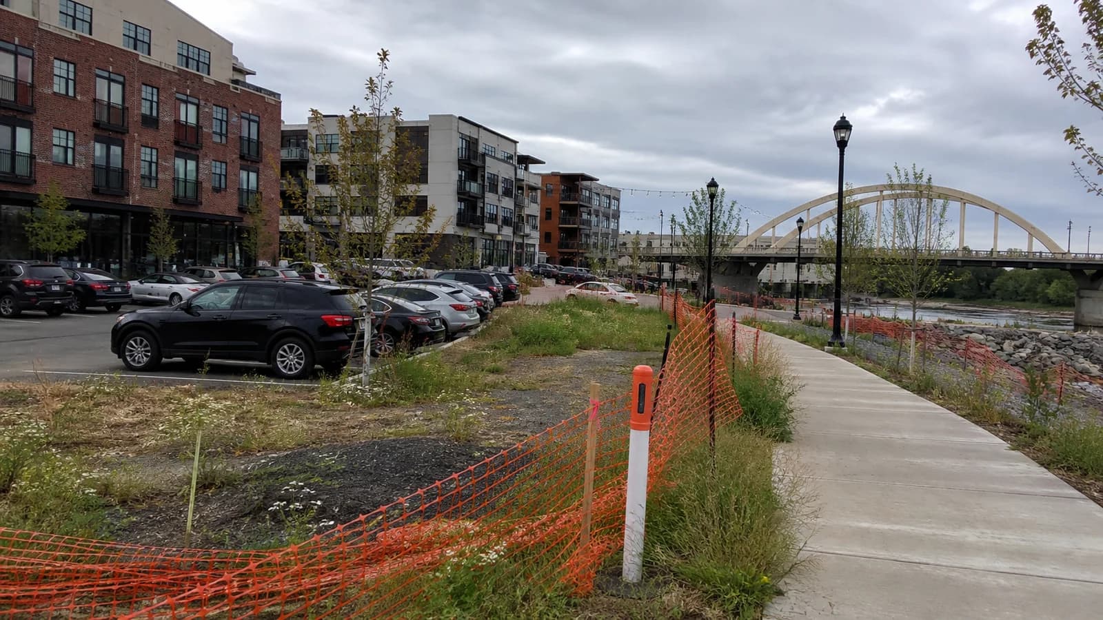 Editorial view of Bridge North development site and Dublin mixed-use buildings beside Riverside Drive in Dublin, Ohio.