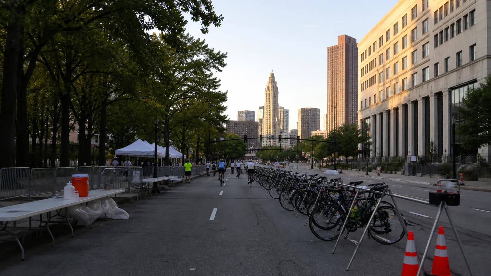 Illustrated cyclists following a temporary event route on a downtown Columbus street.