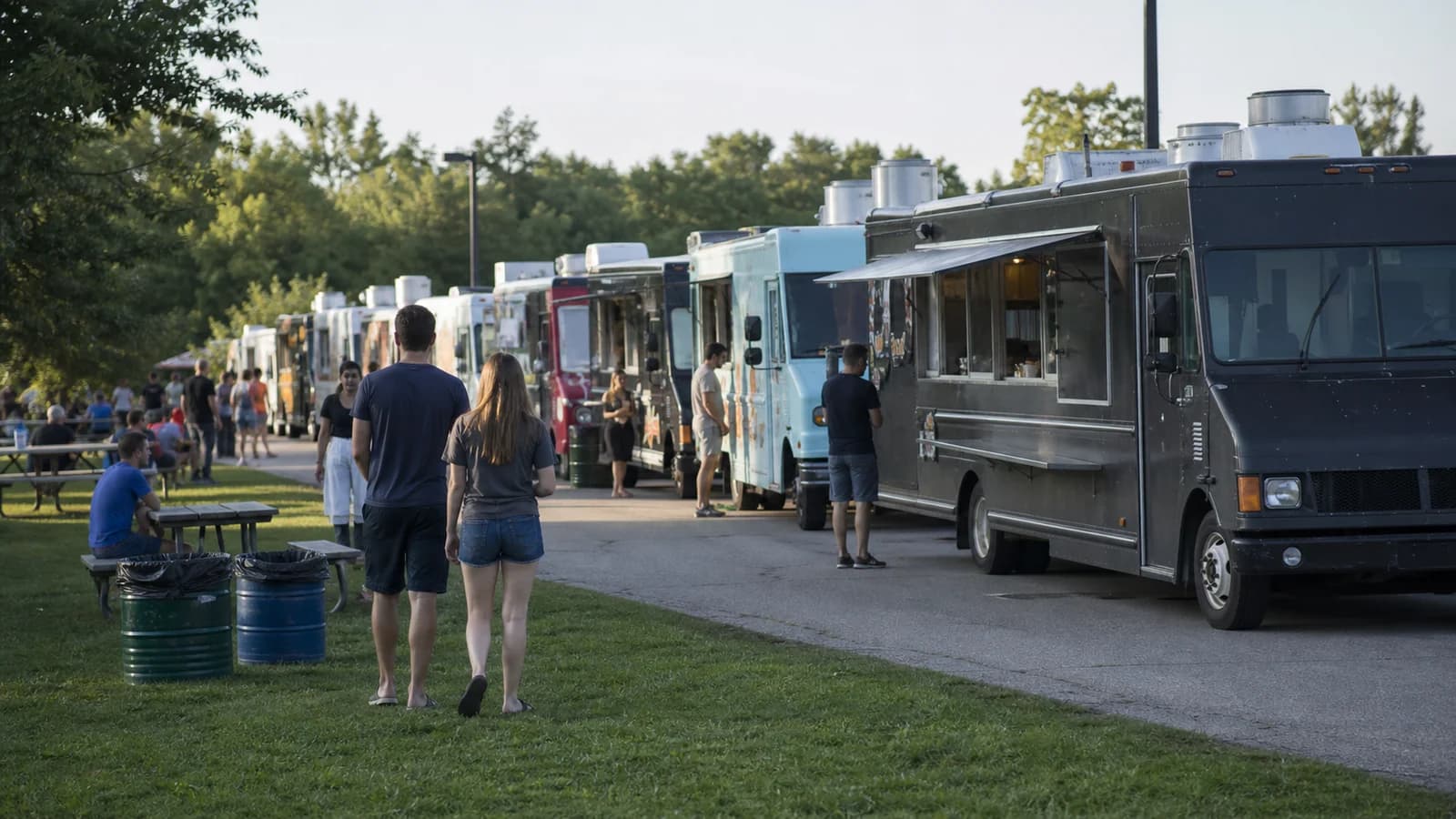 Editorial view of distinct food trucks at Franklin County Fairgrounds and organized festival walkway in Hilliard in Hilliard, Ohio.