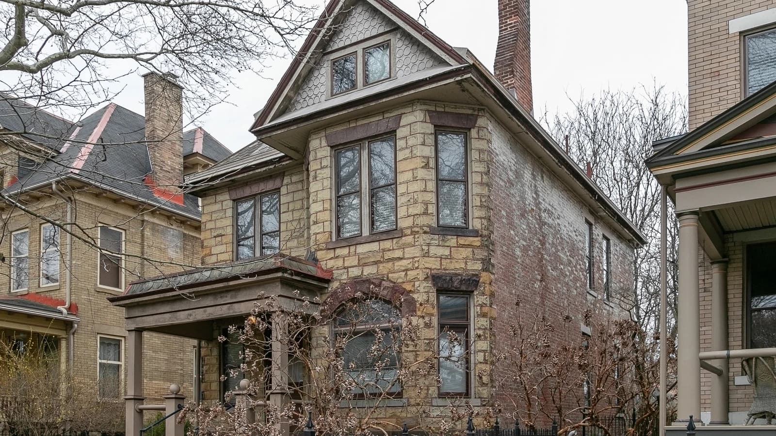 Archival photograph of an older brick and stone house in Victorian Village, Columbus.