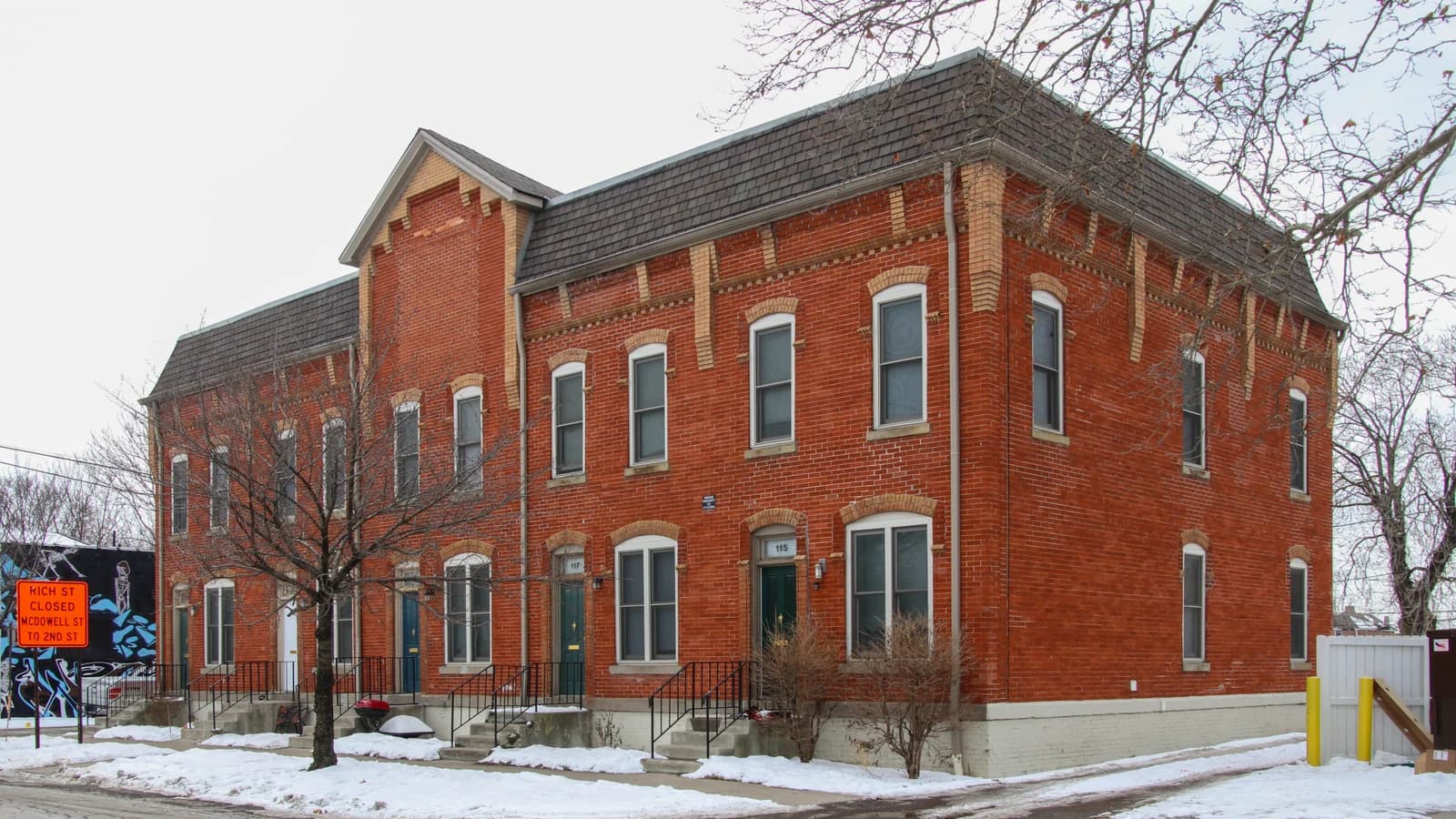 Archival photograph of brick multifamily housing at 115-123 McDowell Street in East Franklinton, Columbus.